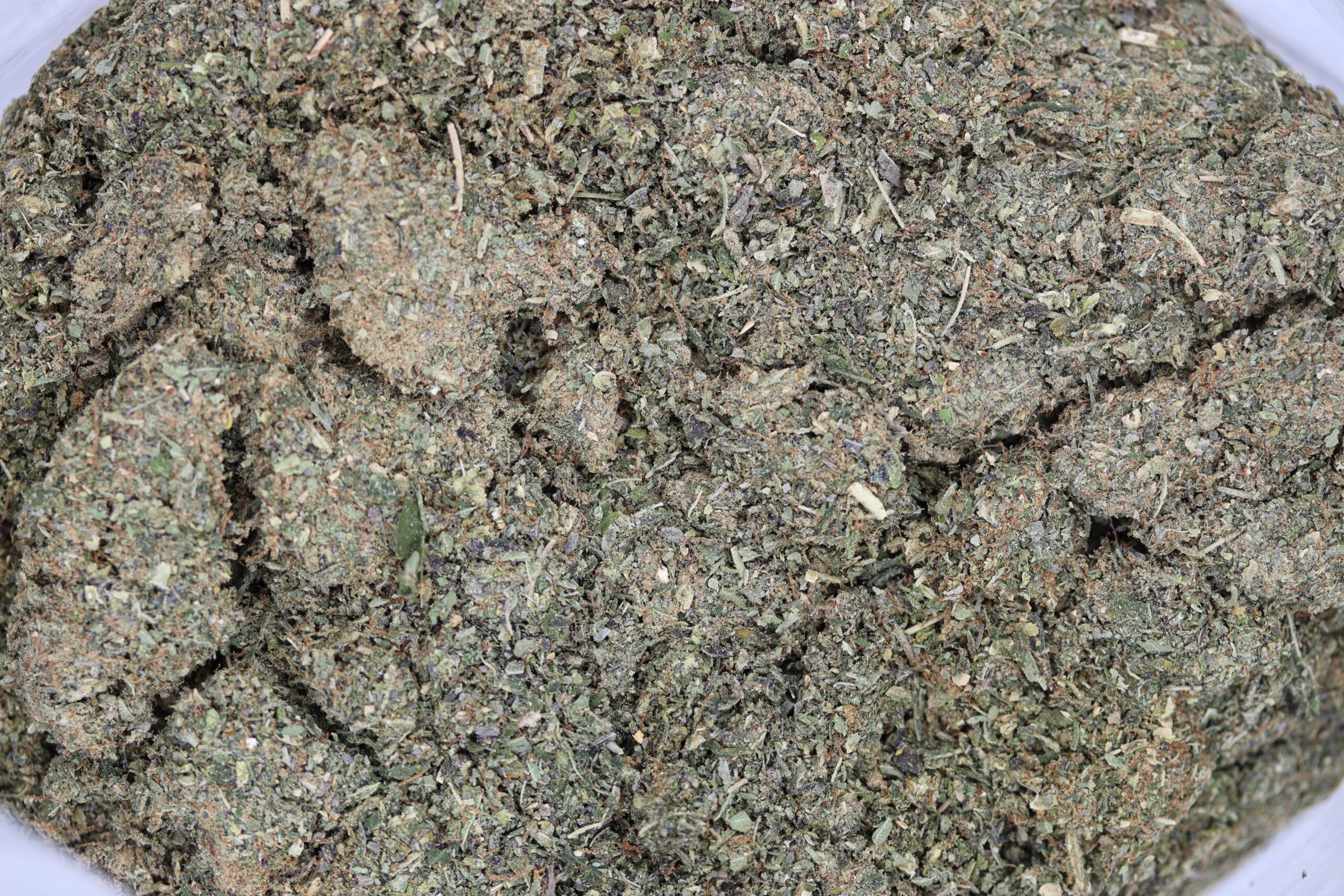 Cannabis shake broken into small pieces, the right texture for decarbing
